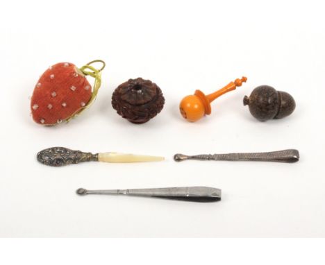 A mixed lot - sewing - comprising a beaded velvet strawberry emery, a steel tweezer/earspoon, 8cm, another in silver, 7cm, a 
