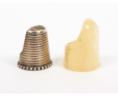 Two thimble guards comprising a silver ribbed example with beaded rim, by Samuel Foskett, London 1892, and a mother of pearl 