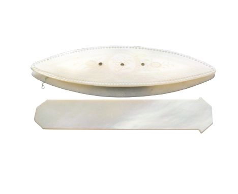 An early 19th Century Chinese engraved mother of pearl shuttle initialled to one side within a circle 'AA' within flowers and