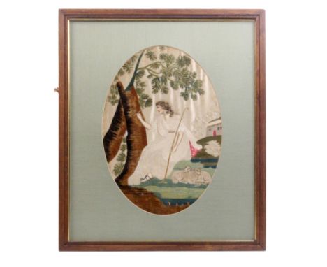 A late 18th Century oval needlework and part painted picture of a shepherdess carving initials into a tree trunk, a cottage b