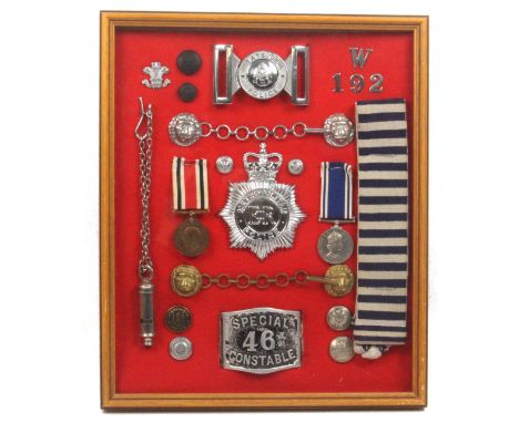 Police badges, medals and buttons - a framed display comprising Tayside Police buckle, Met Police EIIR helmet plate, whistle,