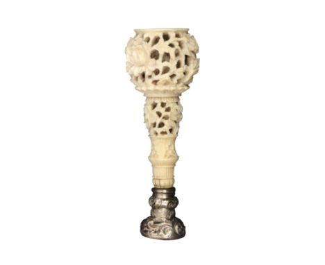 A good mid-19th Century Chinese carved ivory seal handle pierced and carved with flowers and leaves, the chased silver mount 