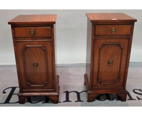 A pair of modern mahogany single drawer bedside cupboards on bracket feet, 32cm wide x 68cm high, (2).