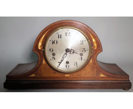 A late Edwardian inlaid mahogany mantel clock, on bun feet, 46cm wide x 20cm high.