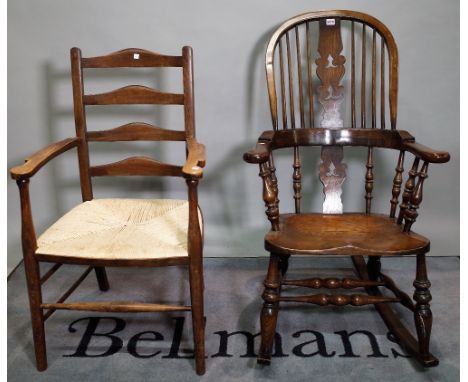 An 18th century style elm stick back rocking open armchair, 65cm wide x 112cm high, and an early 20th century stained beech l
