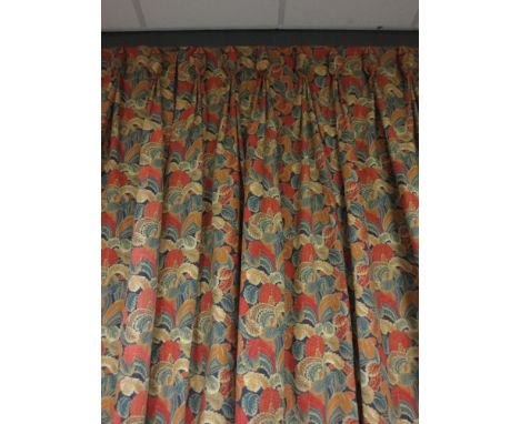 A pair of lined orange patterned curtains, 220cm drop  