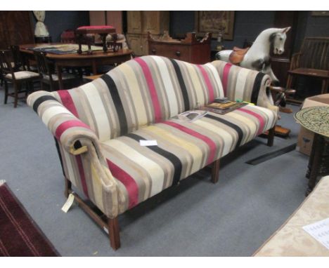 A three seater sofa upholstered in a striped fabric  