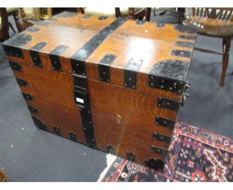 A Victorian oak and metal bound silver chest, and a leather trunk  