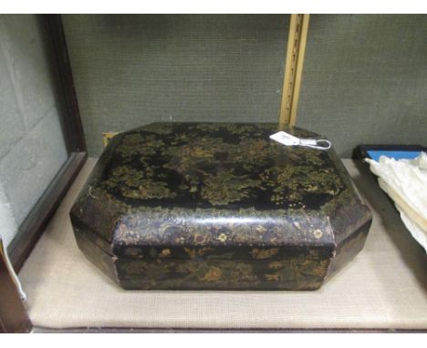 A Chinese export lacquered and gilt octagonal games box, 38cm wide, containing boxes and trays with mother of pearl counters;