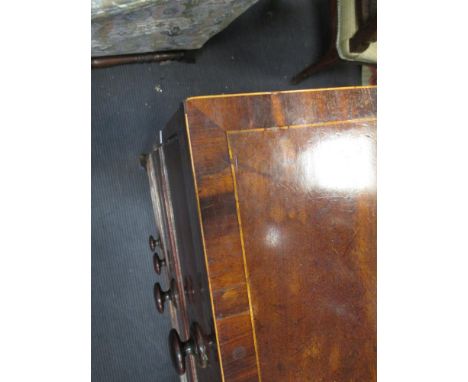 A George III mahogany and satinwood strung flat fronted chest of drawers (some slight damage)  