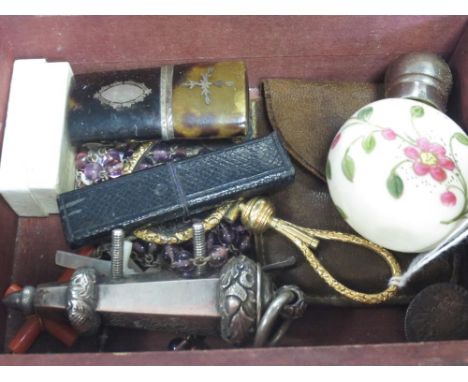 A wooden box containing a collection of objets including Geo III silver coins, coral cross, silver cicada brooch, mounted gla