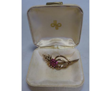A ruby and diamond flower brooch  