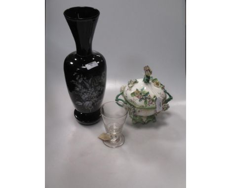 Two early 19th century glass rummers, a black ceramic vase with floral decoration and a continental floral bowl and cover  