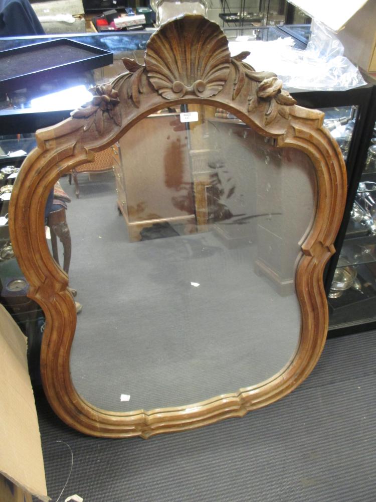A carved walnut framed mirror 108 h x 75 w cm in Cheffins Fine Art