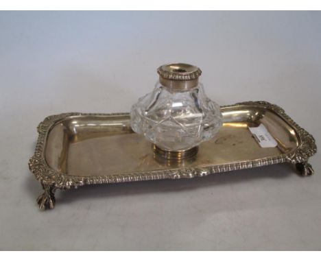 George III silver desk inkstand, with mounted glass inkwell, London, 1815, 22.5cm wide  