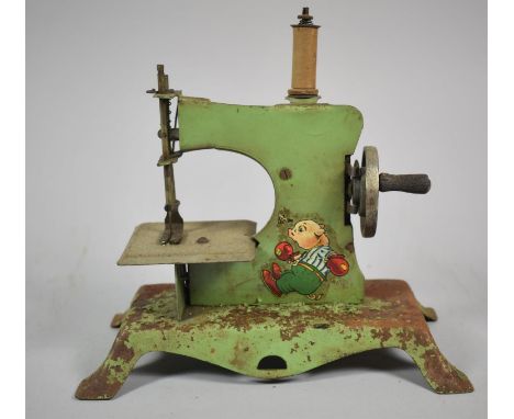 A Vintage Tinplate Child's Sewing Machine, 20cm wide 