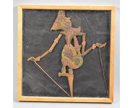 A Framed Indonesian Wooden Articulated Shadow Puppet (Wayang Kulit), 43cm high 