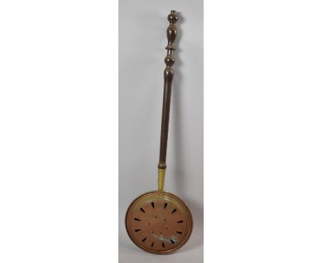 A Vintage Pierced Brass Bed Warming Pan with Turned Wooden Handle 