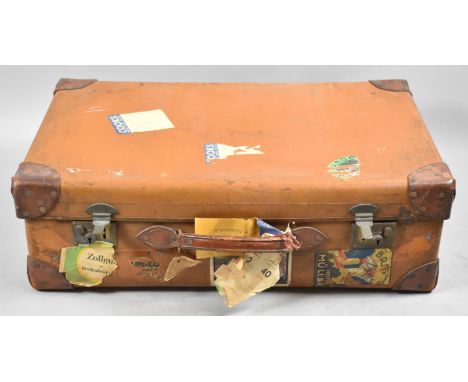 A Vintage Leather Mounted Suitcase with Various Labels, 77cm wide 