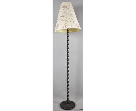 A Modern Metal Standard Lamp with Bobbin Support 