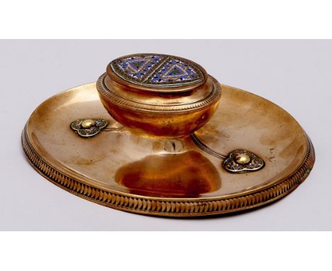 A Victorian oval brass and champleve enamel inkwell, c1880, the urn shaped inkwell on dished base with strapwork and&nbsp; bo