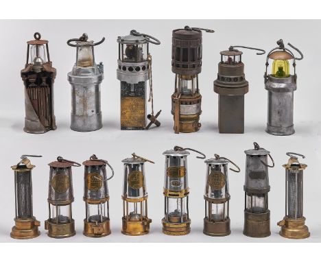 Fourteen miner's lamps, 19th / 20th c, including two brass Geordie lamps, a cap lamp and an interesting cut away lamp for dem