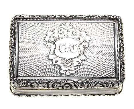 A Victorian silver vinaigrette&nbsp;with unusual grille, engine turned within chased borders, the lid centred by an engraved 