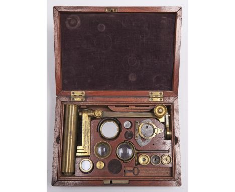 An English brass compound microscope, c1830, the pillar with rackwork and compass joint at the base, on folding tripod, the p