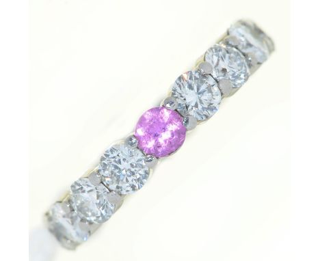 A diamond and coloured diamond eternity ring,&nbsp;in platinum coloured metal, marked I.V.C., 5.8g, size K  Good condition