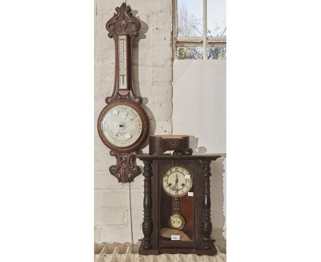 A late Victorian walnut cased wheel barometer with thermometer, with ivorine dial and thermometer register, inscribed Thomas 