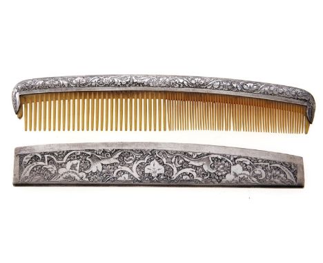 A Middle Eastern silver hair comb and sheath, c1930, intricately engraved to both sides, 15.5cm  Good condition