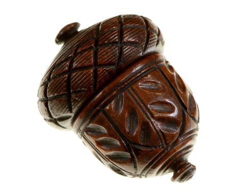 Treen. A richly patinated turned and carved wood nutmeg or spice grater, early 19th c, of acorn shape,&nbsp;the brass rasp se