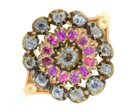 A ruby and diamond concentric cluster ring, 19th c, later gold hoop, 5.5g, size L½  Wear to setting consistent with age