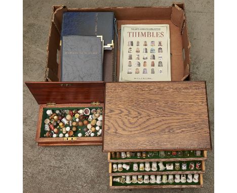 A large collection of modern thimbles, to include an oak thimble cabinet, 38cm w, fitted four drawers, each with five green f