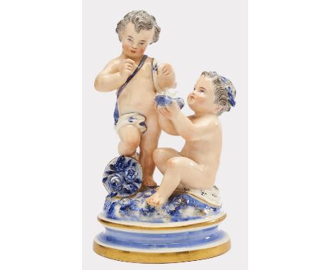 A Royal Worcester group of two children with a nest of hatchlings, 1876, decorated in flesh tones and blue, on round gilt bas