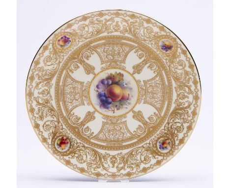 A Royal Worcester cabinet plate, c1913, painted by H. Martin, signed, with groups of fruit on a richly gilt primrose ground, 
