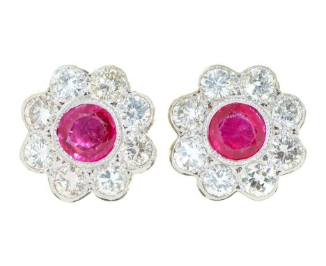 A pair of ruby and diamond cluster ear studs,&nbsp;in white gold, 11mm diam, marked 750, 3g  Slight wear on facets of ruby ev
