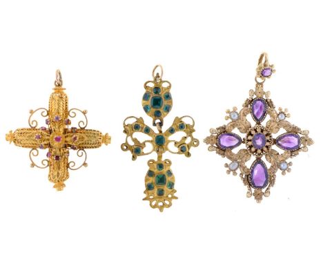 An emerald cruciform pendant, Iberian, 18th c, in gold, fully articulated, 45mm and two other ruby or amethyst set gold cruci