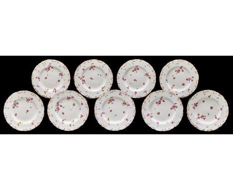 A set of nine Royal Crown Derby dessert plates, 1894, printed and painted with flowers in lightly moulded pink and gilt C-scr