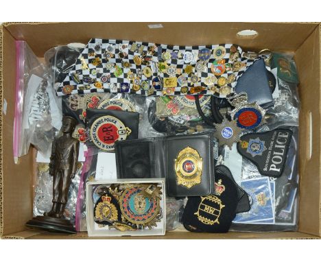 A quantity of police badges, to include Turks and Caicos Islands, white metal and giltmetal and enamel badges and lapel badge