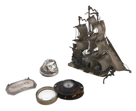 A Continental miniature silver model of a ship, 13cm h, loaded, a Continental silver lion's head place stand, loaded, a silve