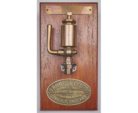 A mounted brass valve and engine plaque for Roby &amp; Co Ltd, engine number 40542, with presentation plaque dated 1988 on th