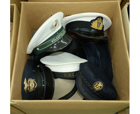 A quantity of police and services hats, to include Tanen cap, Volks Polizei model 57, 1856N, HMS Apollo cap, Lieutenant, Port
