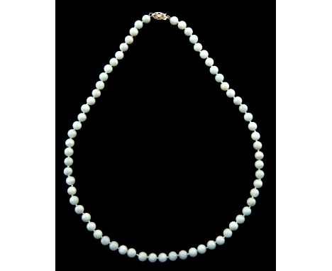 A necklace of jade beads, gold clasp marked 14K, 27.6g  Good condition
