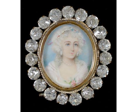 A paste miniature frame, c1900,&nbsp;set with an oval portrait miniature of a lady, plated brass strut, 70mm h  Good conditio