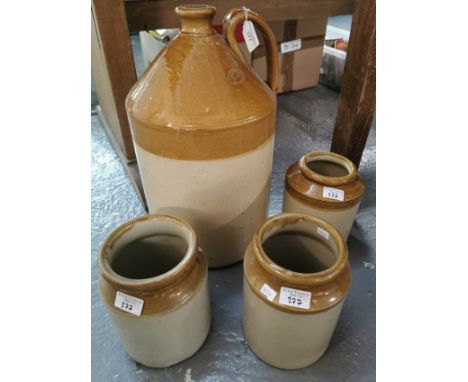 Large vintage stoneware flagon marked Doulton Lambeth Ltd together with three stoneware utensil jars. (4)  (B.P. 21% + VAT)