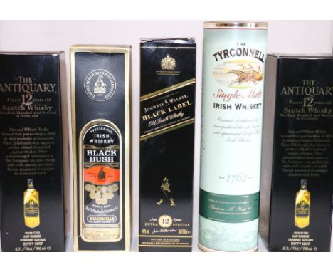 THE TYRCONNELL Irish Single Malt Whisky 70cl, 40% vol., boxed; BLACK BUSH Irish Blended Whisky 70cl, 40% vol.; JOHNNIE WALKER