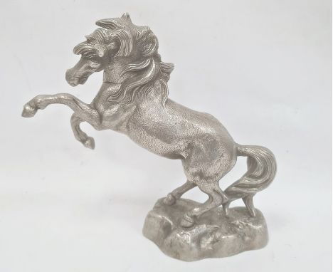 Cast metal model of rearing horse on rocky base, 33cm high
