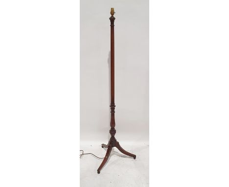 20th century mahogany standard lamp on swept and reeded supports to ball feet