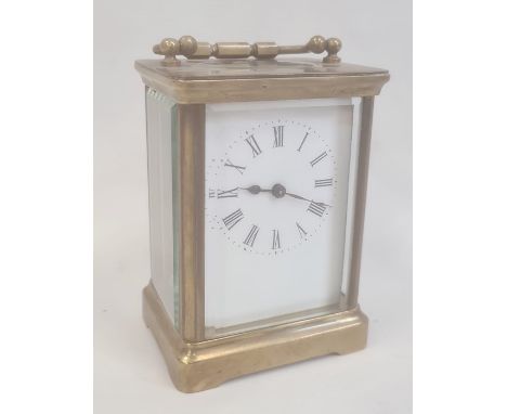 Brass and glass carriage clock with five brass sides, Roman numerals to the dial